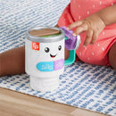 Musical activity coffee mug toy with lights, featuring a smiling face, ABC and 123 buttons, and colorful handle.