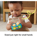 Toddler playing with Fisher Price Laugh & Learn Play Along Ear Buds, brightly colored with music and light features.