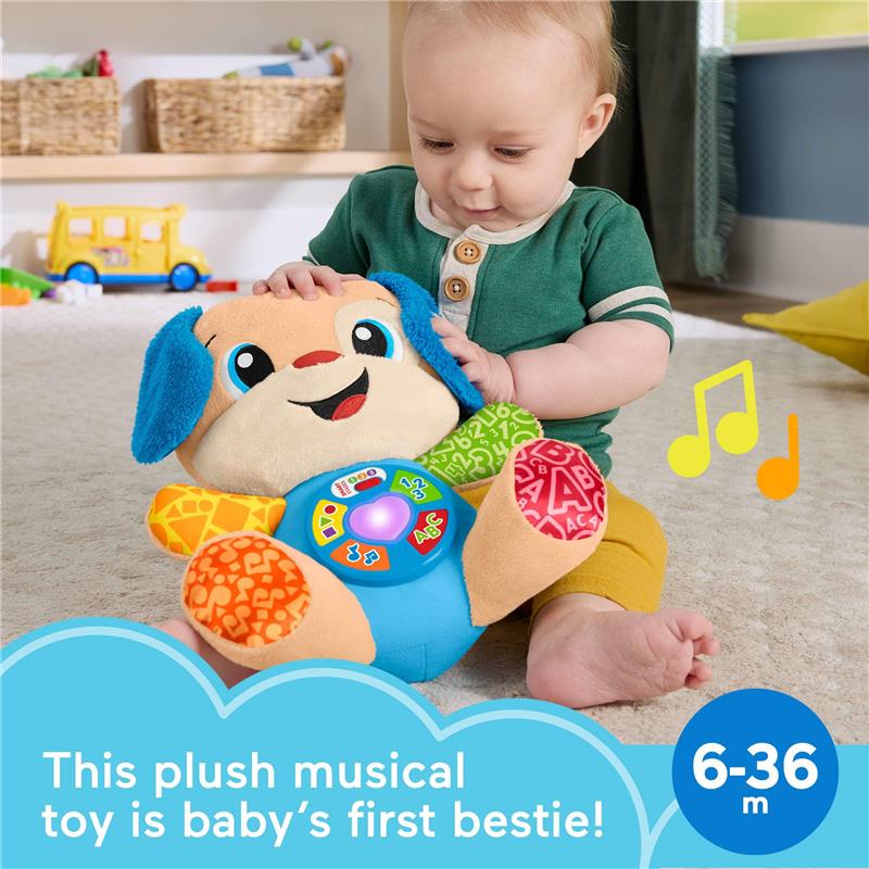 Plush Fisher Price puppy toy with lights, buttons, and learning songs; infant playing with it on a carpet.