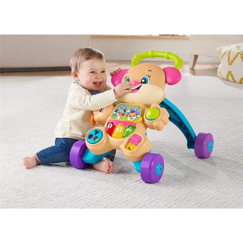 Infant playing with the Fisher Price Laugh & Learn Smart Stages Sis Walker featuring buttons and lights for educational fun.