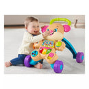 Baby playing with the Fisher Price Laugh & Learn Smart Stages Sis Walker, featuring colorful buttons and educational music.