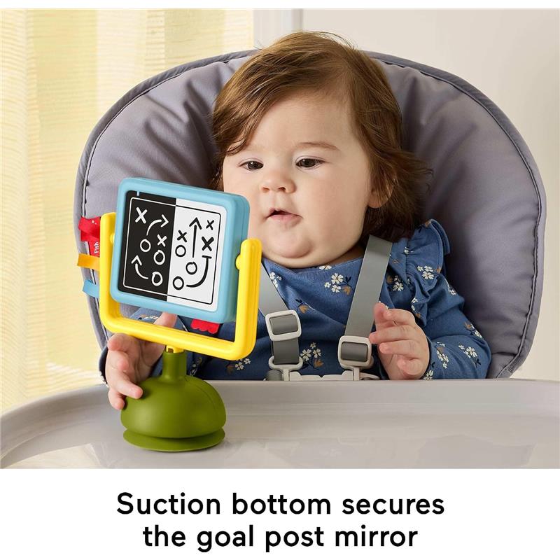 Baby gazes at Fisher-Price Tiny Tailgater Set feature, a colorful goal post mirror with game strategy visuals, suction-secured.