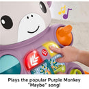 Fisher-Price Baby Walker Learn with Me in purple monkey design, featuring lights and music buttons, with a child’s hand pressing a button.