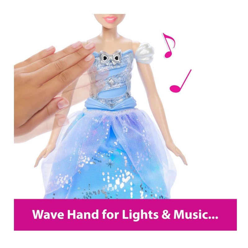 Light-up Cinderella doll in a blue dress, activated by waving a hand; includes musical notes icon and instruction text.