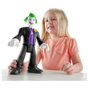 Fisher Price Imaginext DC Super Friends Joker toy, featuring a smiling child playing with the figure on a table.
