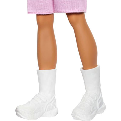 Fisher Price Ken Fashionista doll wearing pink shorts and white athletic shoes with ankle socks.
