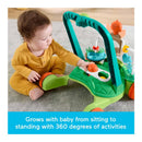 Toddler in a yellow outfit interacts with the Fisher Price Kinetic Walker, featuring colorful toys and activity stations.