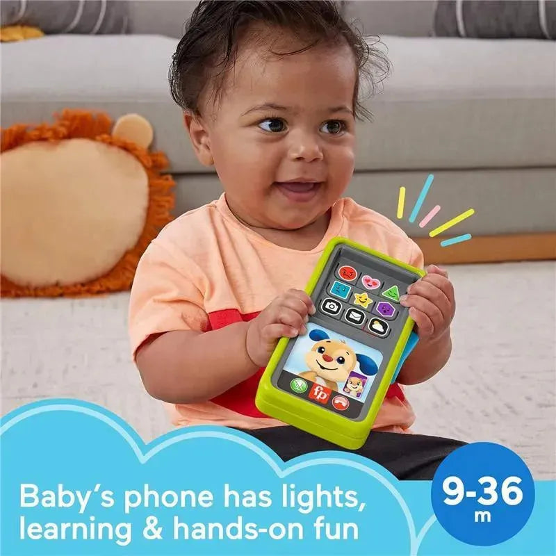 Laugh & Learn 2-in-1 Slide to Learn Smartphone held by a smiling baby, features colorful buttons and playful designs.