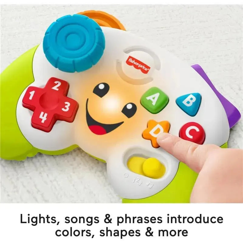 Fisher Price Laugh & Learn Controller toy with colorful buttons and lights; promotes learning through music and phrases.
