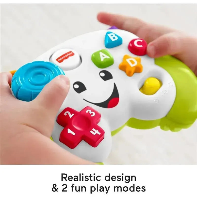 Fisher Price Laugh & Learn game controller toy with colorful buttons, realistic design, and smiling face for interactive play.