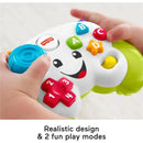 Fisher Price Laugh & Learn game controller toy with colorful buttons, realistic design, and smiling face for interactive play.