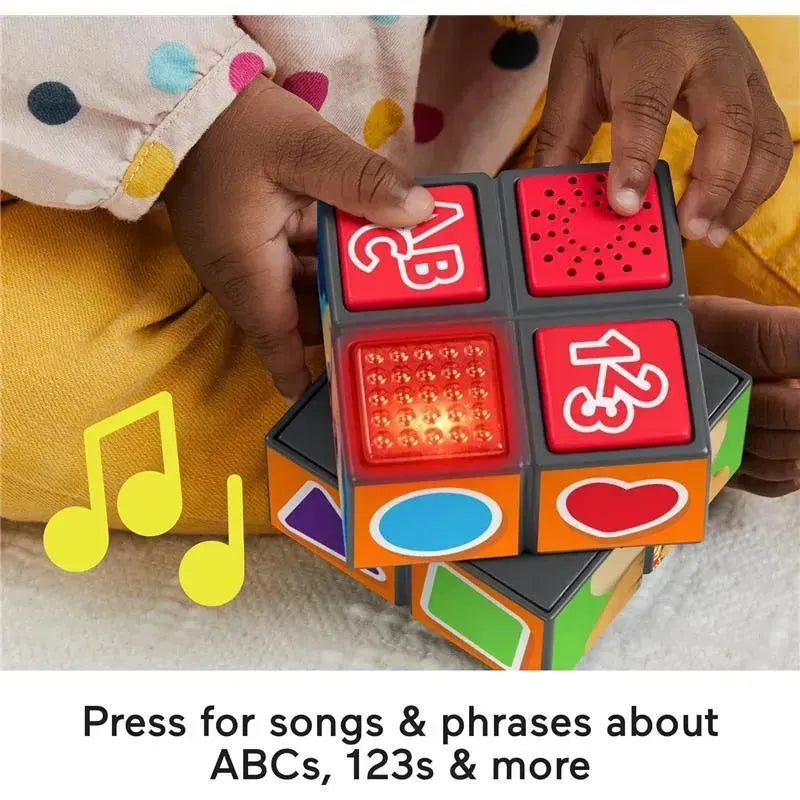Fisher Price Laugh & Learn Activity Cube featuring colorful buttons, lights, and music; promotes learning of ABCs and 123s.