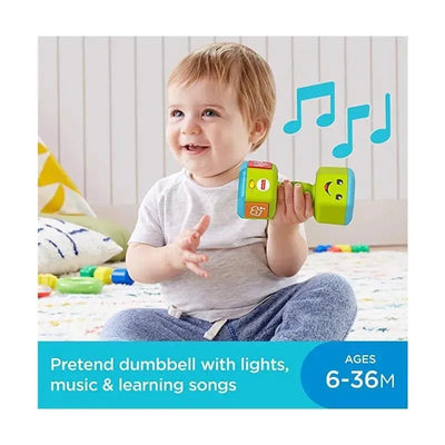 Cheerful toddler holding a colorful Fisher Price pretend dumbbell that features lights, music, and educational songs.