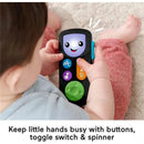 Fisher-Price Laugh & Learn Stream & Learn Remote held by a baby, featuring colorful buttons and a smiling face.