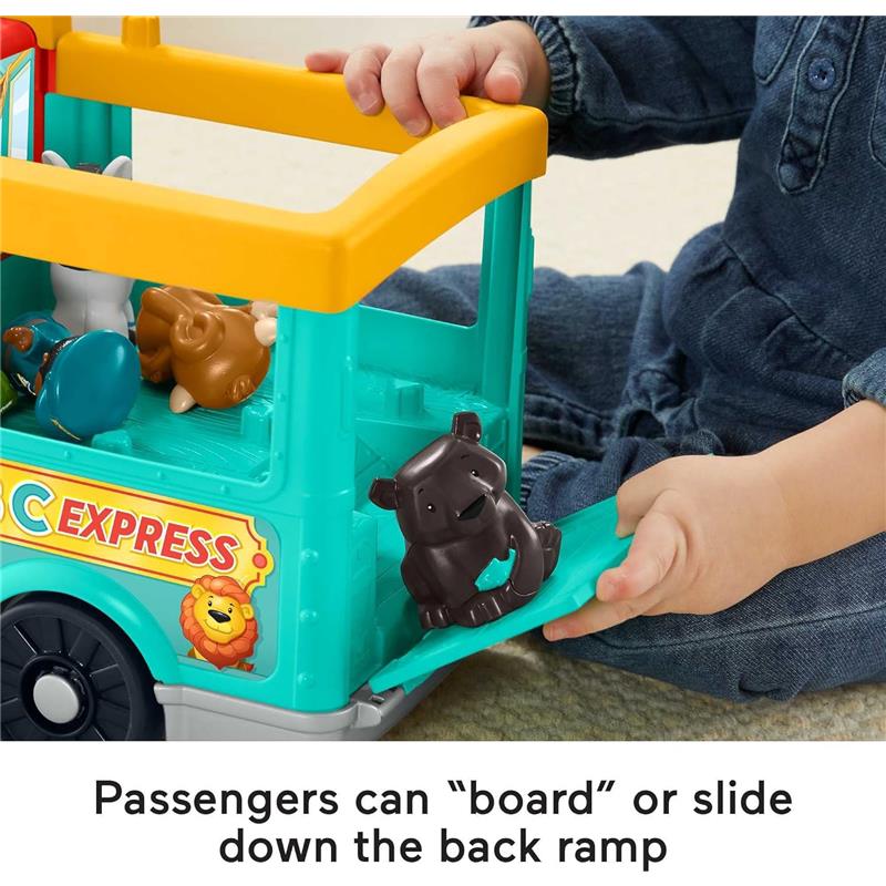 Fisher Price Little People Animal Train toy with a child’s hand holding a ramp; animals inside the train include a bear and a lion.