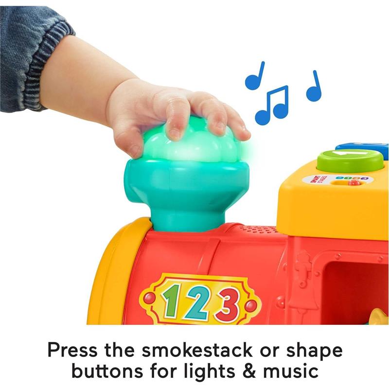 Child pressing the glowing smokestack of the Fisher Price Little People ABC Animal Train toy, activating lights and music.