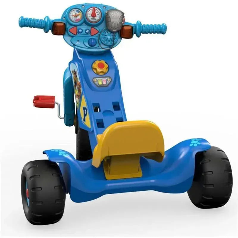 Fisher Price Nickelodeon Paw Patrol tricycle featuring a blue frame, decorative graphics, lights, and sound buttons.