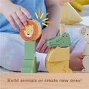 Wooden animal stacking toy featuring a lion, crocodile, and elephant, with a child’s hand interacting with the pieces.