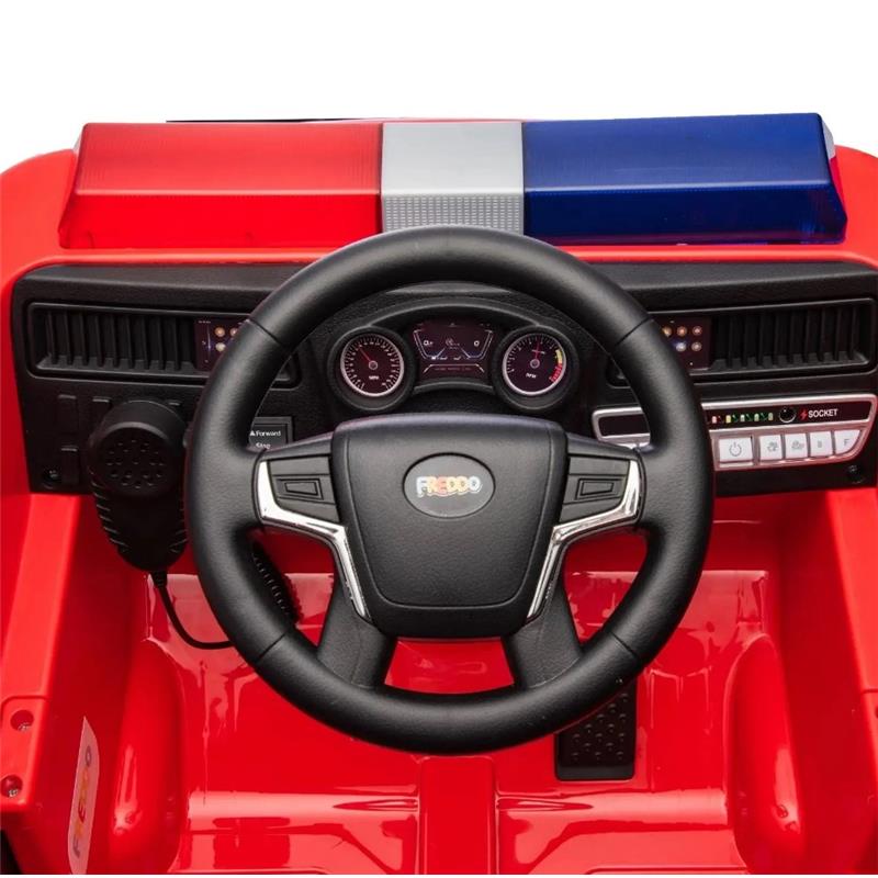 Red dashboard of the Freddo 1 Seater Fire Truck with a steering wheel, speedometer, and control buttons.