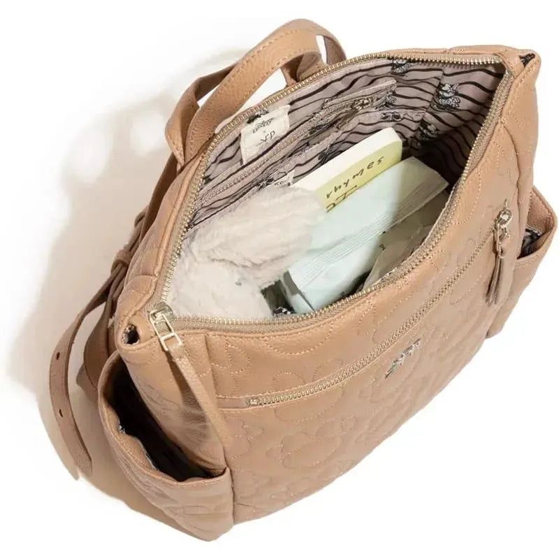 Tan Mini Minimal Backpack from Freshly Picked featuring a floral quilted design, with visible interior pockets and organization.