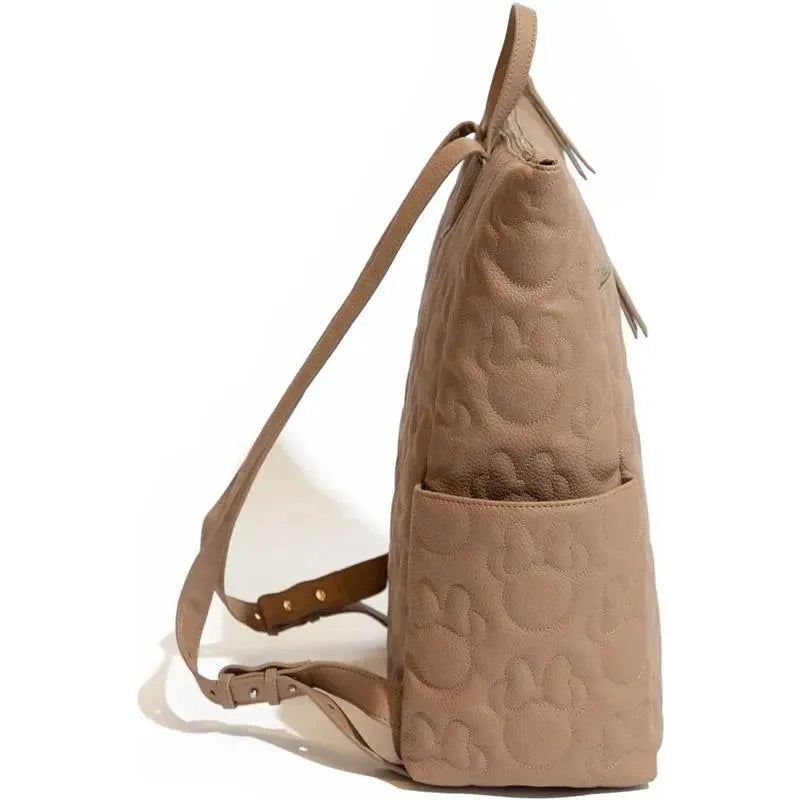 Minnie Mouse Minimal Backpack in beige with paw print texture and adjustable straps, showcasing a side view.