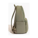 Sage green neoprene city backpack showcasing a side view with a zippered closure and adjustable strap.