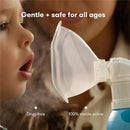 Saline nasal inhaler aimed at children, shown being used to soothe a stuffy nose, with mist visibly dispersing.
