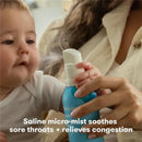 Frida Baby NoseFrida saline inhaler used on a baby, emitting a micro-mist to soothe sore throats and relieve congestion.