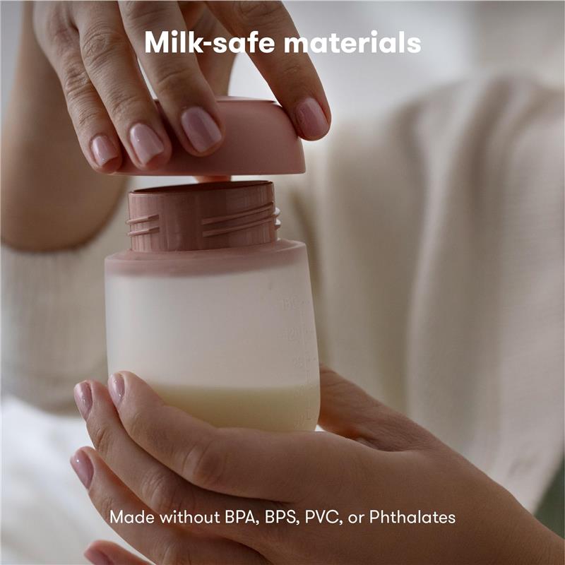 Frida Mom Breast Pump Flange Insert 24mm held by a person, featuring a milk-safe design without harmful materials.