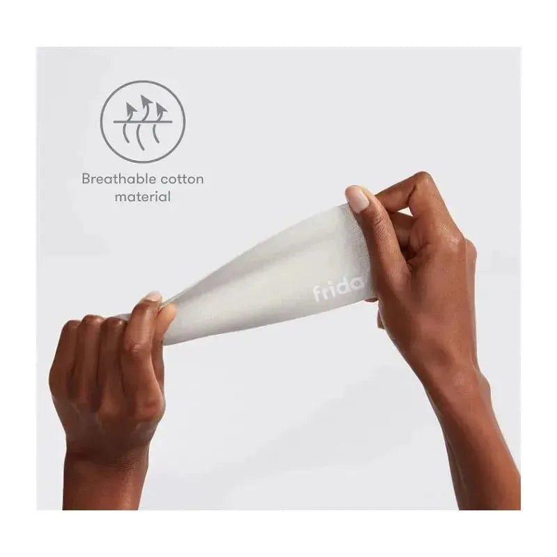 Frida Mom pregnancy belly tape made of breathable cotton, being held and stretched by a hand.