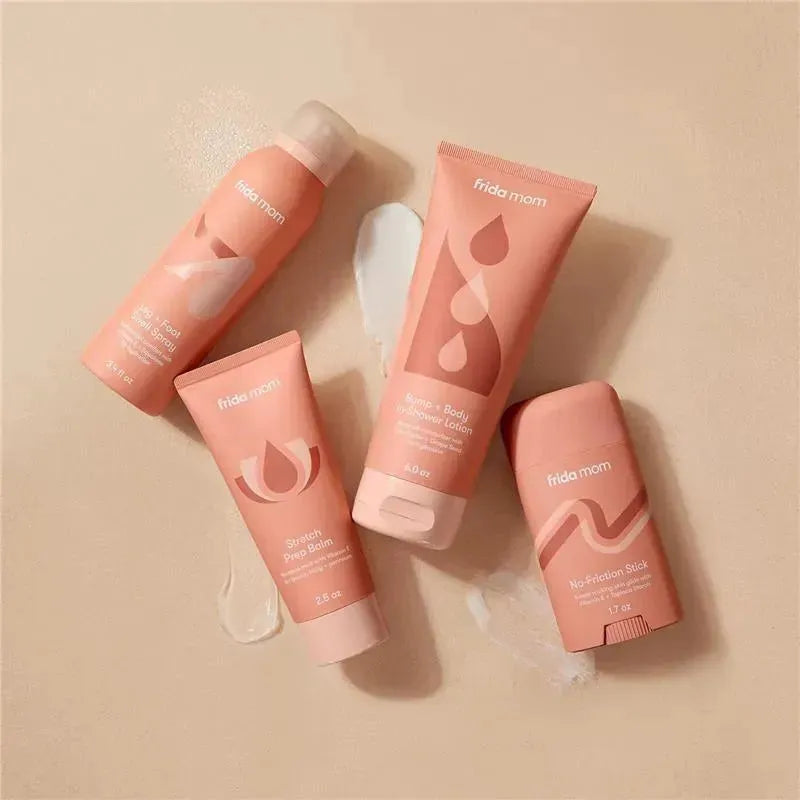 Frida Mom Stretch Prep Balm, 2.5 oz, alongside three other skincare products on a light background.