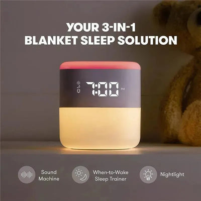 3-in-1 sound machine, nightlight, and sleep trainer with a digital clock displaying 7:00 PM. Bear toy in the background.