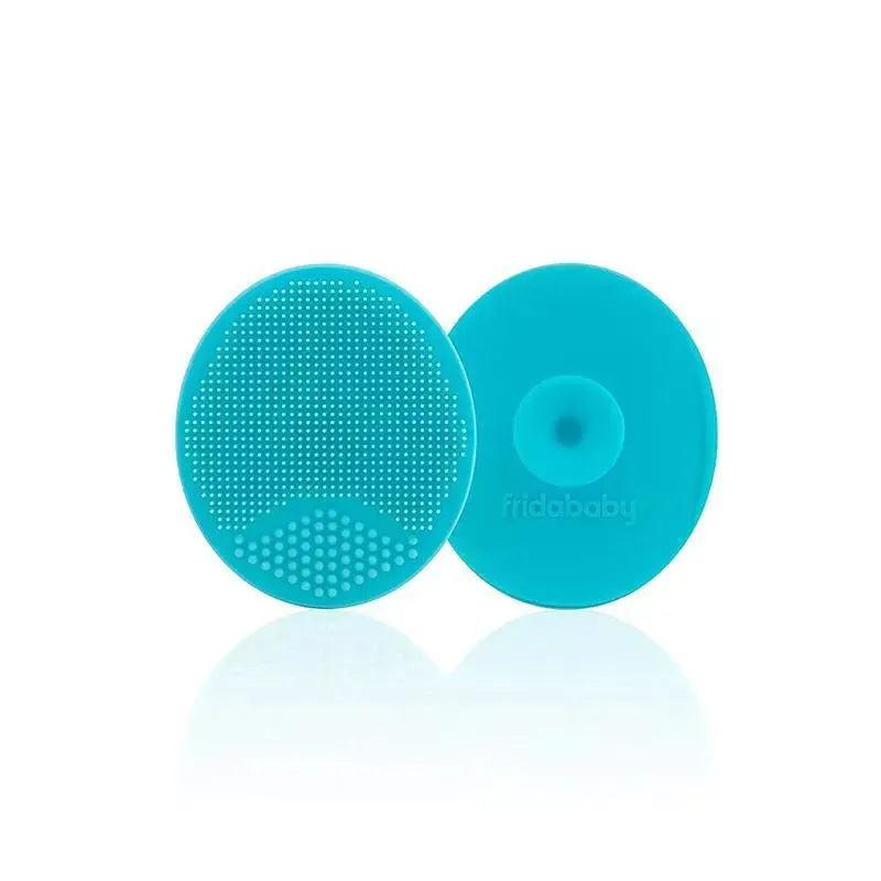 Two turquoise silicone skin soothers from Fridababy featuring textured surfaces for gentle skincare.