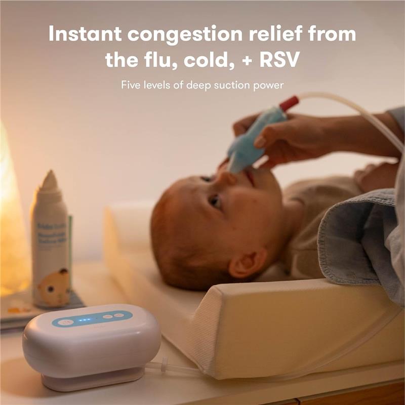Electric Nosefrida Pro is used to provide congestion relief to a child, with the product visible alongside a calming nightlight.
