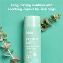 Fridababy Breathe Easy Vapor Bubble Bath + Body Wash in a mint green bottle, with eucalyptus leaves and text highlighting its soothing properties.