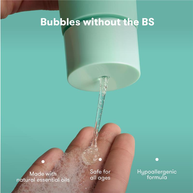 Fridababy Eucalyptus Vapor Bubble Bath and Body Wash being poured from a mint-green bottle into a hand, showcasing its bubbly texture.