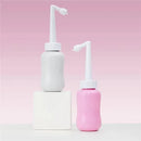 Frida Mom postpartum upside down peri bottles in gray and pink, designed for postpartum hygiene.