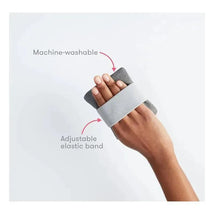 Gas + Colic Heating Pad with adjustable elastic band and machine-washable fabric shown held in hand.
