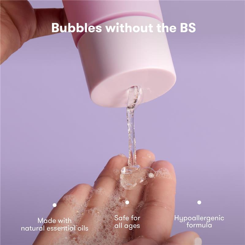 Fridababy Lavender Baby & Kids Bubble Bath being poured onto a hand, showcasing its bubbly texture and calming qualities.