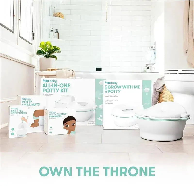 FridaBaby Potty Cleanup Essentials, including a potty kit, liners, and mats, arranged in a bright bathroom setting.