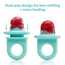 Teal Fridababy Push Pop Feeder featuring a push-pop design, filled with red fruit pieces, promotes easier feeding.