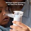 Portable nebulizer being used on a child, showcasing its ultra-quiet operation for easy dosing.