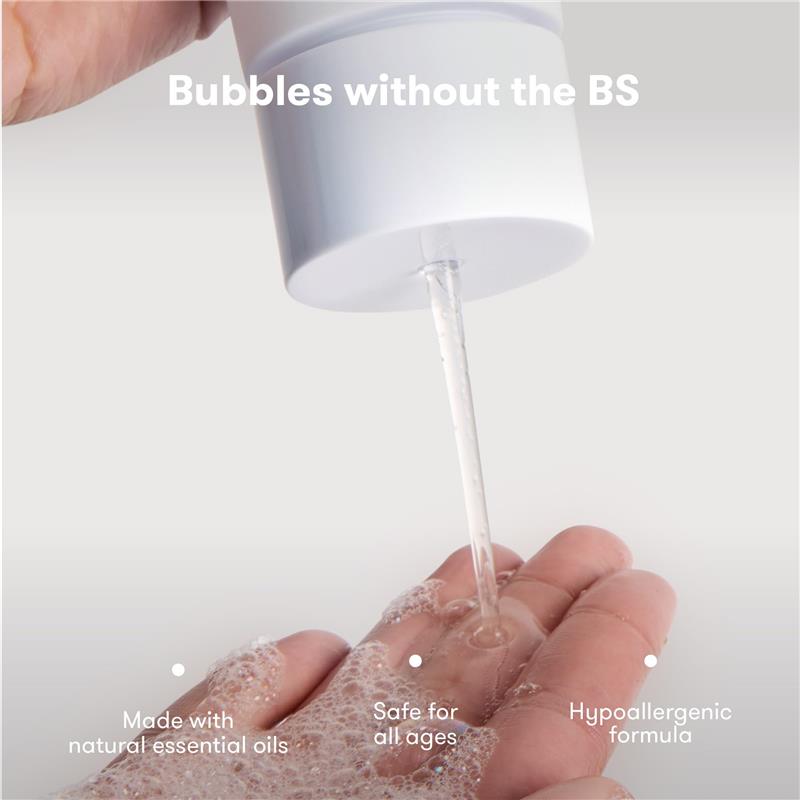 Fridababy Unscented Bubble Bath and Body Wash is being poured onto a hand, showcasing its gentle formula with visible bubbles.