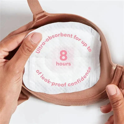 Ultra-absorbent FridaMom nursing pad held in hand, with text indicating it provides 8 hours of leak-proof confidence.
