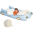 Convertible kids air mattress designed as a blue car, featuring a child laughing, a fluffy blanket, and a storage bag.