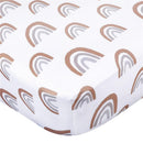 Knit crib sheet featuring a boho rainbow pattern in earthy tones on a white background. Suitable for babies.