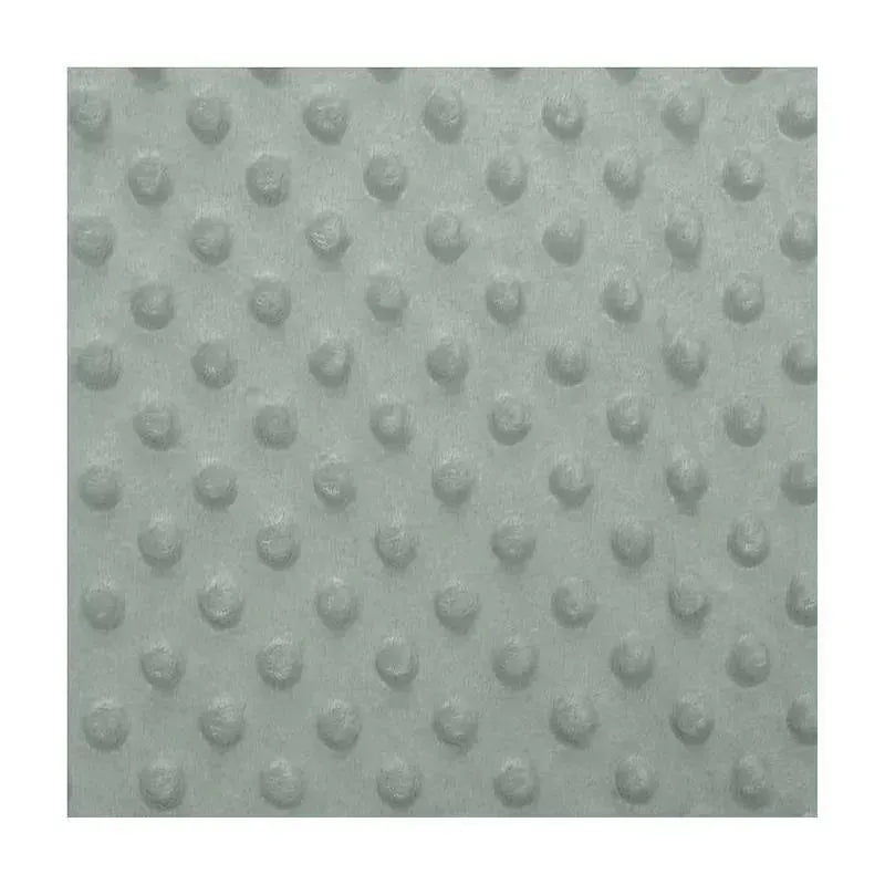 Green changing pad cover with a textured dot pattern, designed for baby bedding.