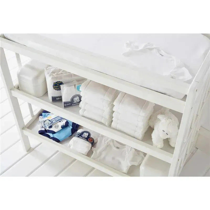 Gerber 4-pack short sleeve bodysuits in white displayed on a white shelf, alongside folded diapers and a soft toy.