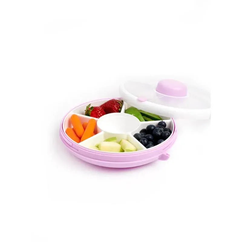 Gobe Kids Small Snack Spinner in Taro Purple, featuring compartments with strawberries, blueberries, carrots, green beans, and apple chunks.