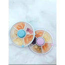 Small Snack Spinner Flip Snack Boxes in Taro Purple, filled with fruits, crackers, and candies, on a snowy surface.